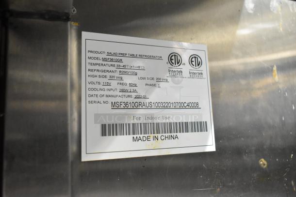 2022 Atosa MSF3610GR stainless steel commercial prep table with casters, model label showing specs and serial number.