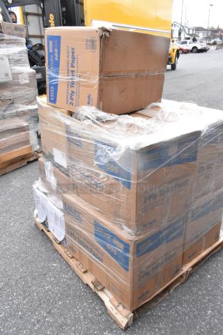 Stacked pallets of scratch and dent boxes of individually wrapped 2-ply toilet paper, wrapped in plastic film.