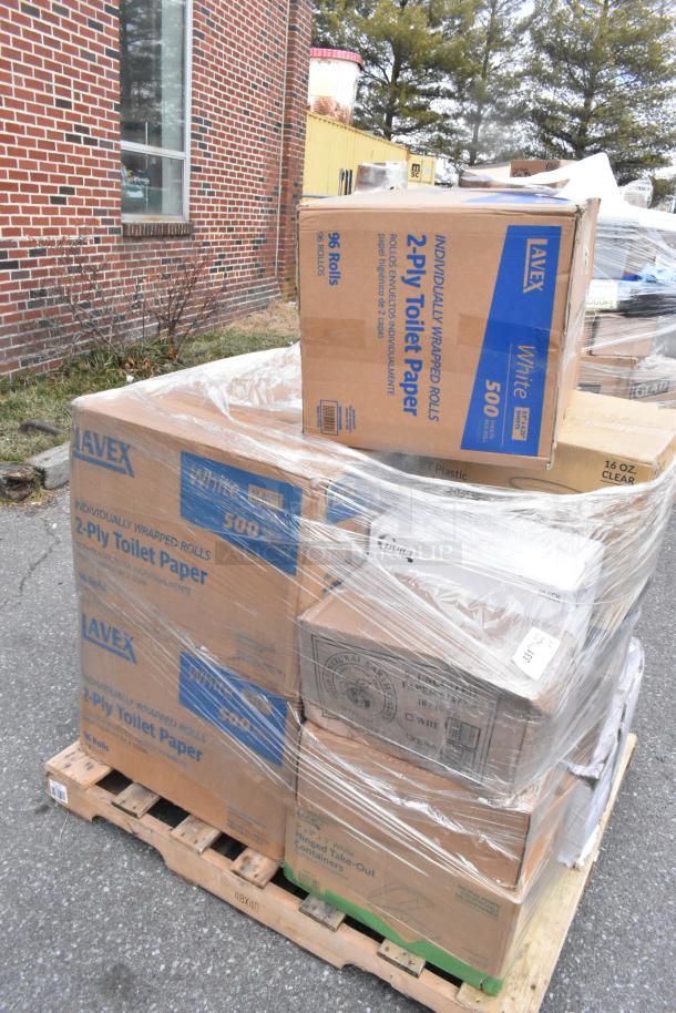Pallet of various boxed items, including Lavex toilet paper, wrapped in plastic, some boxes show wear.