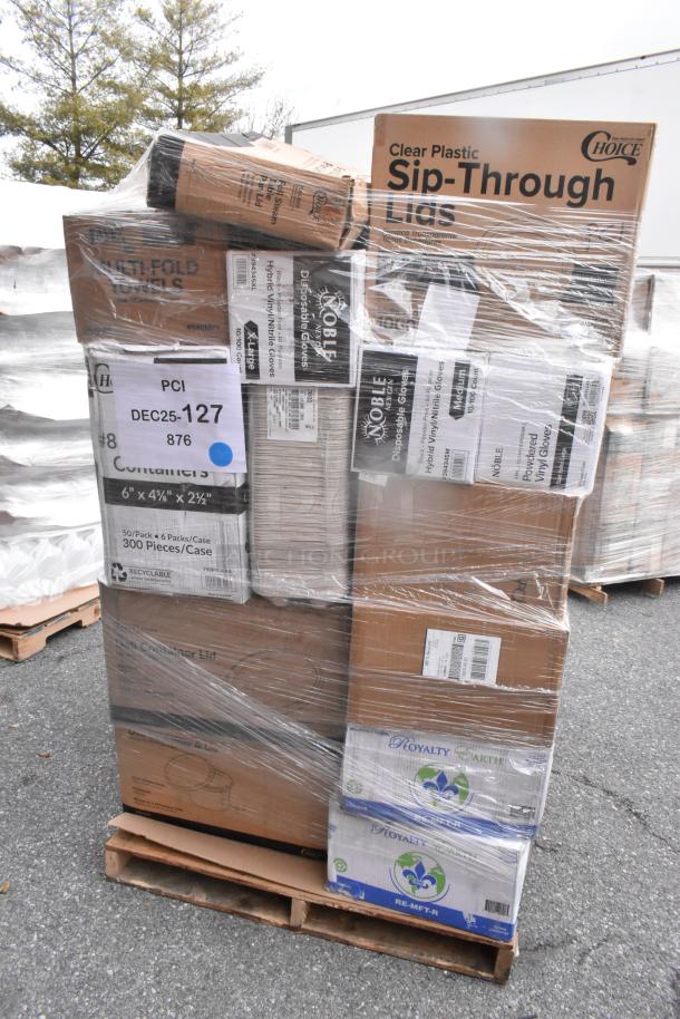 Stack of assorted boxes including cold cups, cake circles, and popcorn buckets. Items are new, marked as scratch and dent, wrapped on a pallet. Various brand labels visible.