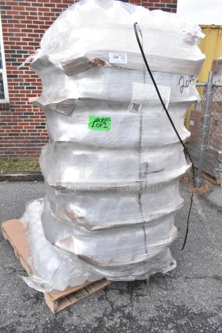 Pallet of brand new scratch and dent translucent HDPE milk jugs, 1-gallon size. Wrapped and labeled for auction sale.