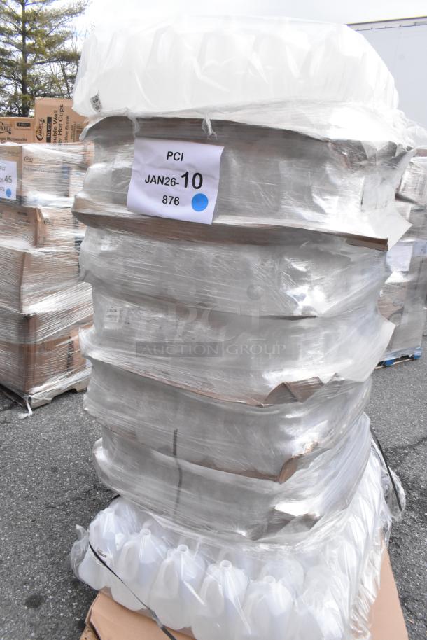 Pallet of scratch and dent 1-gallon translucent HDPE milk jugs with handles, wrapped, labeled "PCI JAN26-10 876."