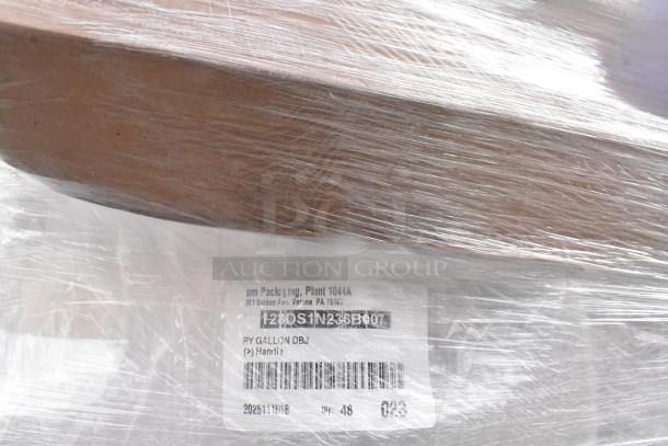 Pallet of 1-gallon translucent HDPE milk jugs, brand new, scratch and dent. Wrapped in plastic with visible shipping label.
