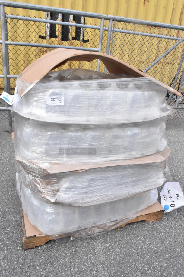 Pallet of brand new, scratch and dent translucent 1-gallon HDPE milk jugs with handles, wrapped and labeled for auction.