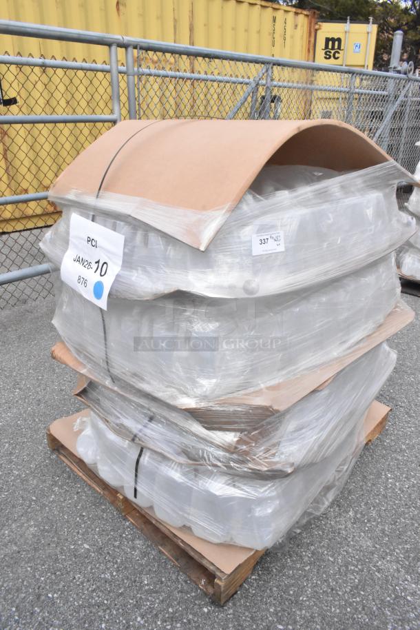 Pallet of 1-gallon translucent HDPE milk jugs with handles, brand new scratch and dent condition, wrapped for shipment.