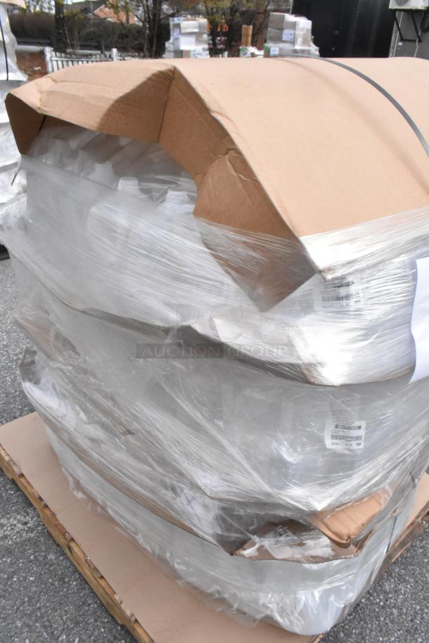 Pallet of brand new 1-gallon translucent HDPE milk jugs, some packaging damage visible, barcodes and shipping labels attached.