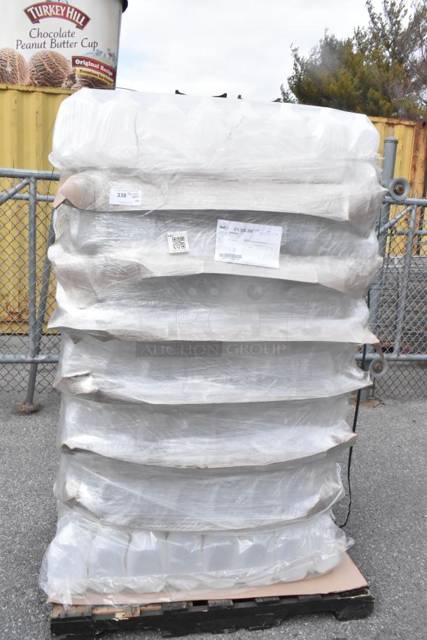 Pallet of brand new translucent HDPE 1-gallon milk jugs with handles, wrapped, with visible shipping labels. Scratch and dent condition.