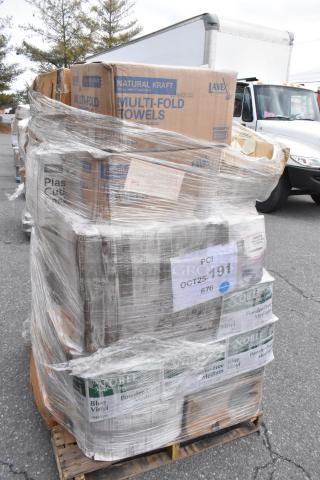 Pallet with new scratch and dent items; multi-fold towels, gloves, T-shirt bags. Marked "PCI OCT25-191 #76." Wrapped in plastic.
