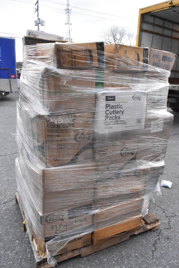 Pallet of boxes labeled with various items including gloves, T-shirt bags, and paper towels, wrapped in plastic for auction.