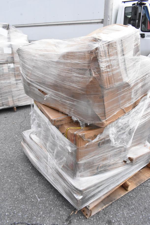 Pallet with boxed items including plastic jars, tabletop, and trash can, wrapped in plastic. Some boxes show wear.