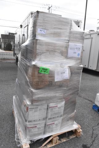 Pallet with 33 new scratch and dent items, wrapped in plastic. Includes lids, drink carrier, hot cups, plates. Labels visible.