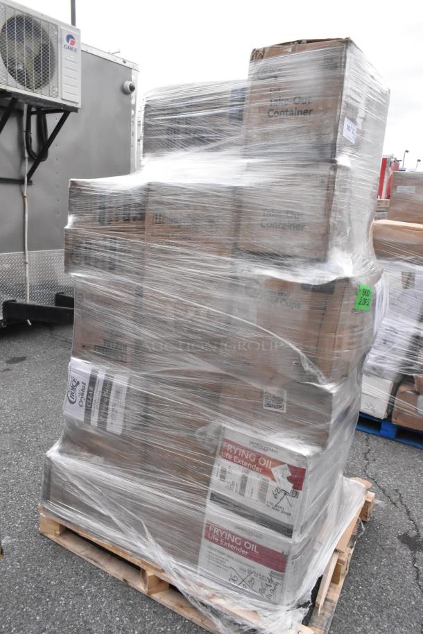 Pallet of 33 scratch and dent items, including lids, drink carriers, hot cups, and plates, wrapped in plastic.