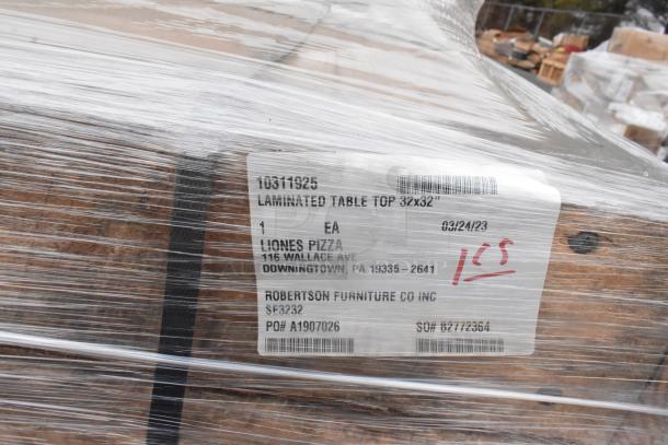 Wrapped pallet with laminated table top 32x32 inch label from Robertson Furniture Co. Inc. Tag dated 03/24/23, marked "1 CS".