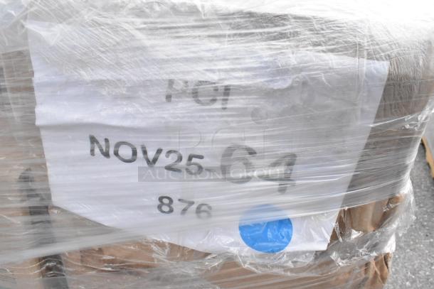 Plastic-wrapped pallet labeled "NOV25-64" containing assorted new scratch and dent items, including napkins and portion cups.