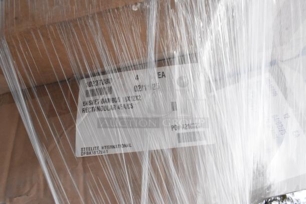 35 brand new scratch and dent items wrapped in plastic, including baskets and Vollrath RT100-DR Retro Kit, with visible labels.