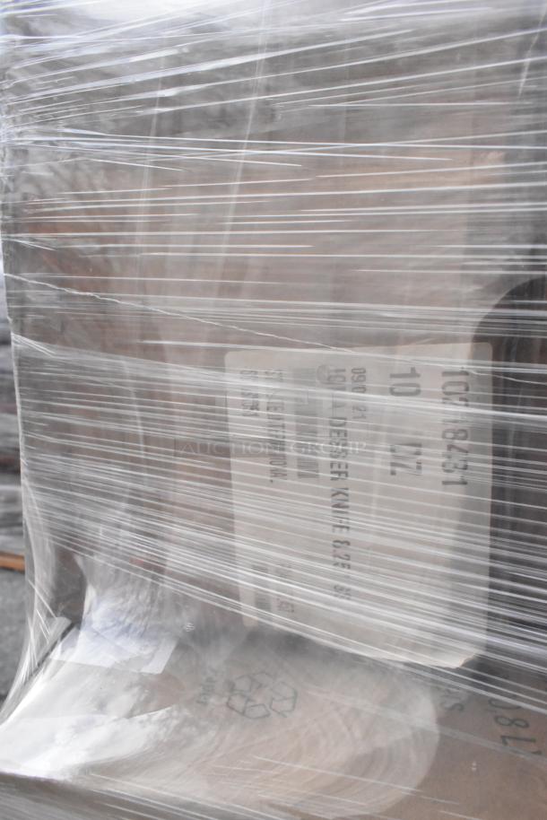 Pallet wrapped in plastic showing labels for scratch and dent items including baskets and Vollrath RT100-DR. New condition.
