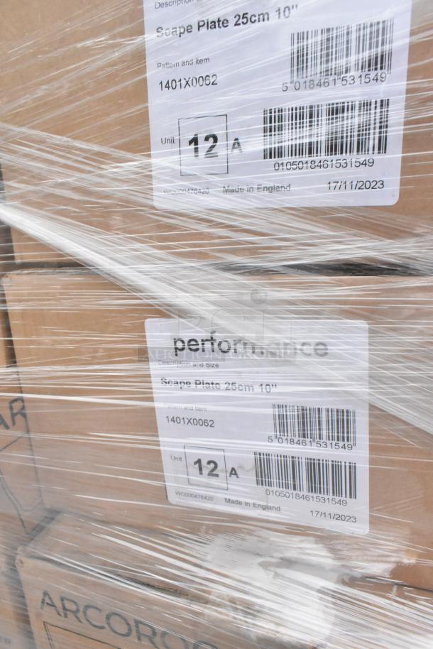 Pallet of boxed kitchenware items including Steelite Scape Plates, Arcoroc Glasses, wrapped in plastic with item labels visible.