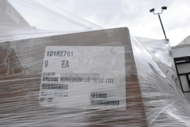 Pallet wrapped in plastic containing boxes labeled "Dredge w/Medium Lid 16 oz" from Voldatag Company LLC.