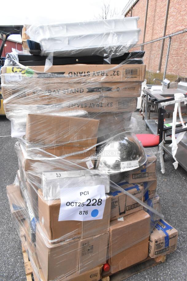 Pallet with 42 items, including cutting board, fan motor, juice glasses, and dessert glasses, wrapped in plastic. Tags show "PCI OCT25-228 876". Scratch and dent condition.