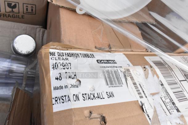 Box of Carlisle clear SAN tumblers labeled 9oz Old Fashioned, 48-pack. Features visible scratches and dents.