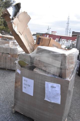 Pallet of 20 scratch and dent items, including fiber container, produce bags, and bowls. Wrapped with labels indicating Oct 08-04.