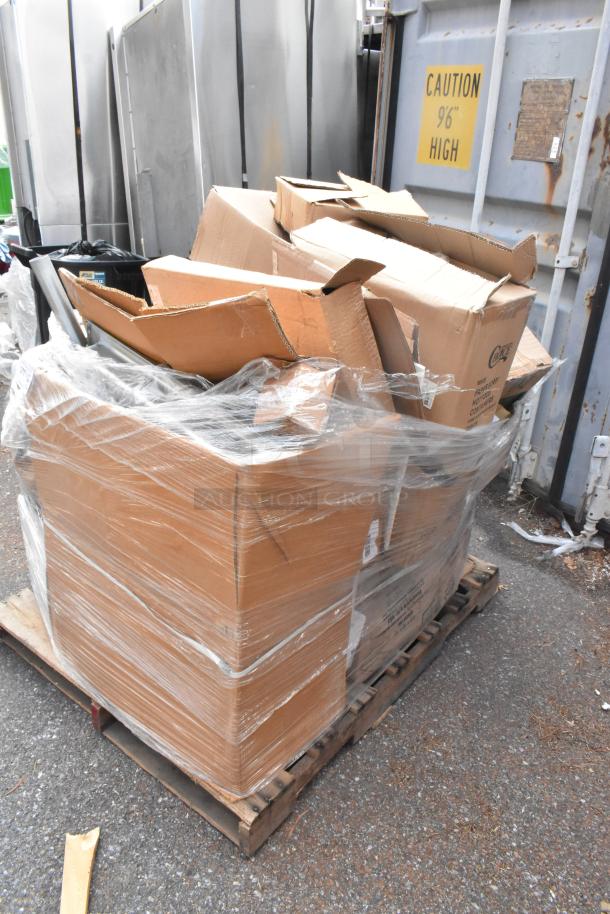 Plastic-wrapped pallet with cardboard boxes containing new scratch and dent items like clutch assemblies. Boxes stacked and sealed.