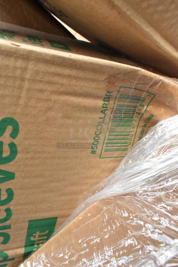 Brown cardboard boxes labeled "#500COLLARBR" with visible plastic wrap; items include clutch assemblies.