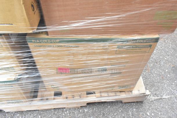 Sealed cardboard boxes labeled "PLA Cold Cup" on a pallet with plastic wrap, containing new scratch and dent cups and lids.
