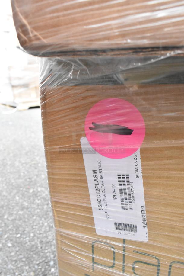 Brown cardboard box with visible shipping label, marked "55CC12PLASM" and "CUP 25CZ PLA CLEAR 1M STALK." Pink sticker on the side.