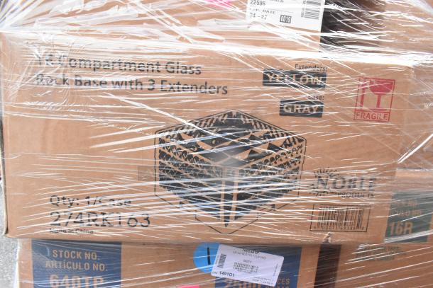 Stacked boxes wrapped in plastic, labeled "Noble Products." Visible text includes "Compartment Glass," "Qty: 1/Case," and "Fragile."