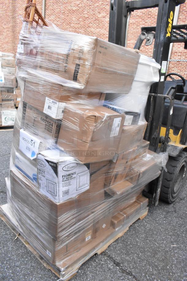 Pallet of 37 new scratch and dent items wrapped in plastic, including table tops, wicker baskets, and plastic plates.