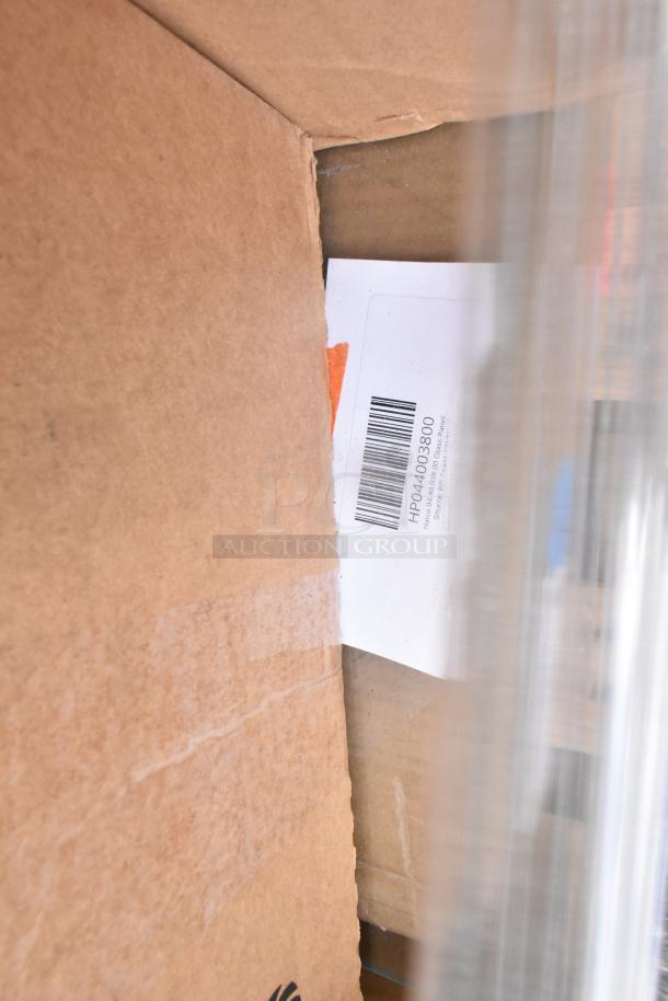 Cardboard box containing new scratch and dent items, includes ice bags, catering trays, and containers. Visible barcode label inside.