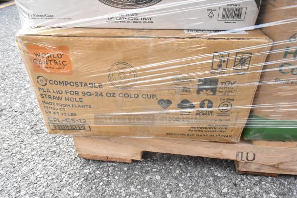 Boxes of new items on a pallet, including World Centric compostable PLA lids, catering trays. Labeled for eco-friendly use.