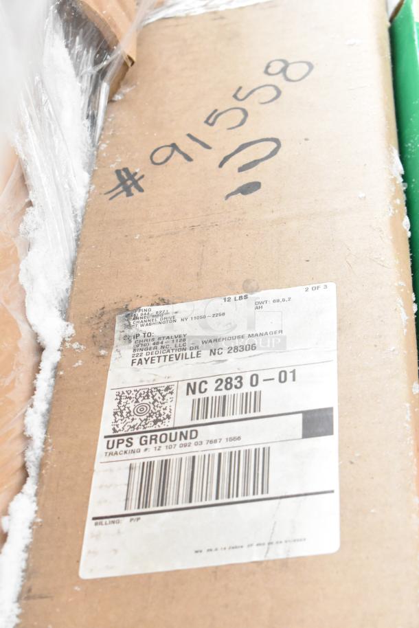 Cardboard box with shipping label, marked "#91558", containing 12 new scratch and dent items including shelving components.