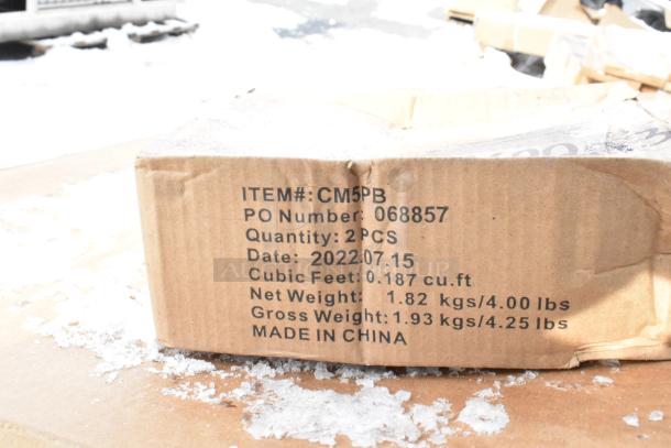 Cardboard box labeled "CM5PB" with item details, including PO number, quantity (2), date (2022.07.15), weights, and "Made in China."