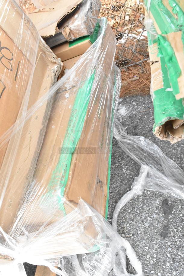 Damaged packaging of 12 brand new scratch and dent items, including Quantum Food Service posts and Metro shelves.