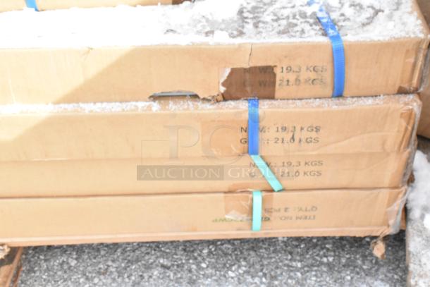 Boxes of brand new scratch and dent items on a pallet, containing Metro Posts, Serv-Ware wire shelves, green and silver epoxy.