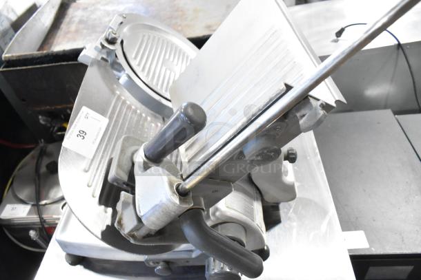 Hobart 2612 stainless steel meat slicer with blade sharpener, 115V, 1 phase, tested and working. Tag labeled "39."