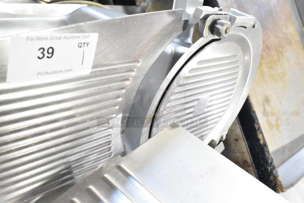 Hobart 2612 stainless steel meat slicer with blade sharpener, 115 volts, shown in tested working condition. Model label visible.