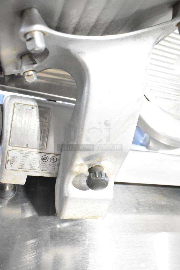 Hobart 2612 stainless steel commercial meat slicer with blade sharpener, visible model label, tested and working condition.