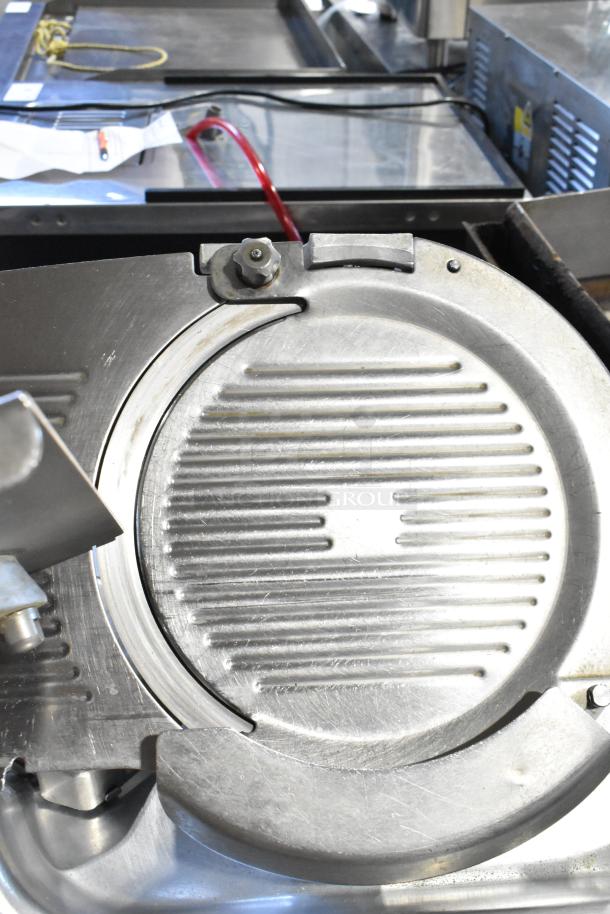 Hobart 2612 stainless steel meat slicer with blade sharpener. Tested and working. 115 volts, 1 phase.