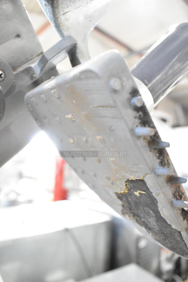 Hobart 2612 stainless steel meat slicer with attached blade sharpener. Visible wear. Model: 2612, 115 volts, 1 phase.