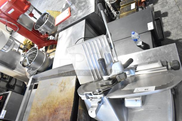 Hobart 2612 stainless steel commercial meat slicer with blade sharpener, tested and working, shown on stainless steel countertop.