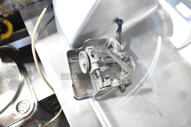 Hobart 2612 stainless steel commercial meat slicer with blade sharpener, 115 volts, 1 phase, tested and working condition.