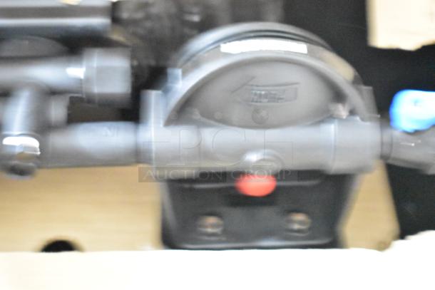 Everpure EV932773 Insurice Triple PF-7FC-S water filter cartridge assembly, new condition, black assembly unit.