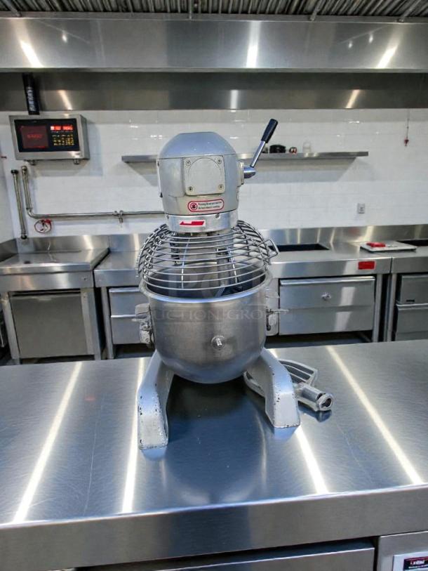 Superior Condition UPM-M20-3 Commercial 20 Qt Planetary Mixer, 110V, fully tested, silver finish, in a commercial kitchen setting.