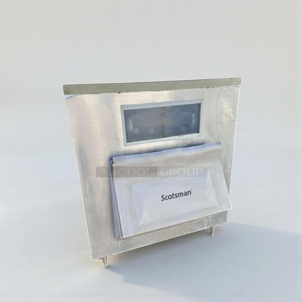 Silver Scotsman BH1100BB-A commercial ice storage bin in immaculate condition, NSF certified, with a front Scotsman logo.