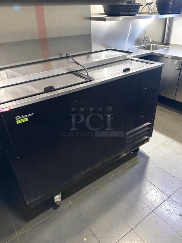 Alto-Shaam 6.10 ESG commercial heated display cabinet, top-tier condition, natural gas, black exterior, on casters.