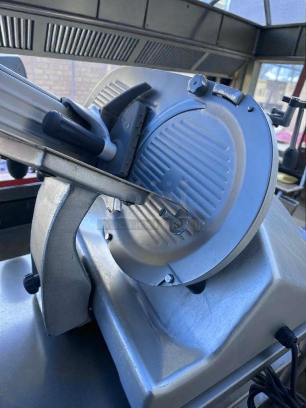 High-grade Hobart commercial meat slicer, heavy-duty manual, UL & NSF certified, fully tested, in excellent condition.