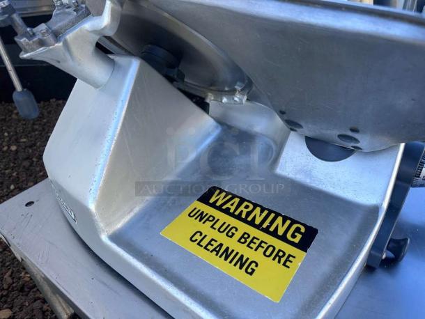 High-grade Hobart commercial meat slicer, heavy-duty, UL & NSF certified, fully tested, warning label visible, excellent condition.
